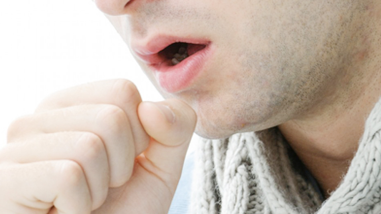 man coughing